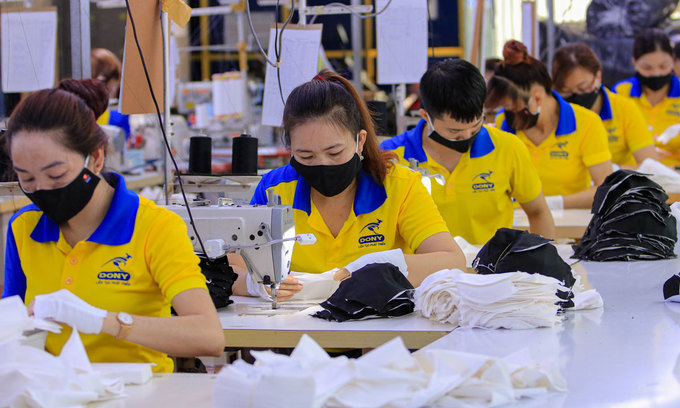 Workers make garment products
